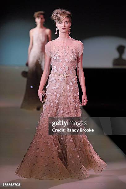 Model walks the runway during the Armani - One Night Only New York at SuperPier on October 24, 2013 in New York City.