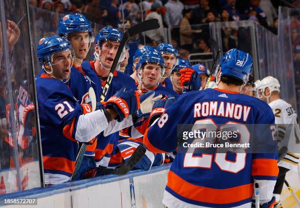 Alexander Romanov of the New York Islanders celebrates his second period goal against the Boston Bruins at UBS Arena on December 15, 2023 in Elmont,...