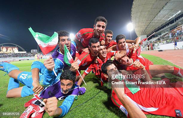 The players of Iran celebrate at the end of the FIFA U 17 World Cup group E match between Austria and Iran at Khalifa Bin Zayed Stadium on October...