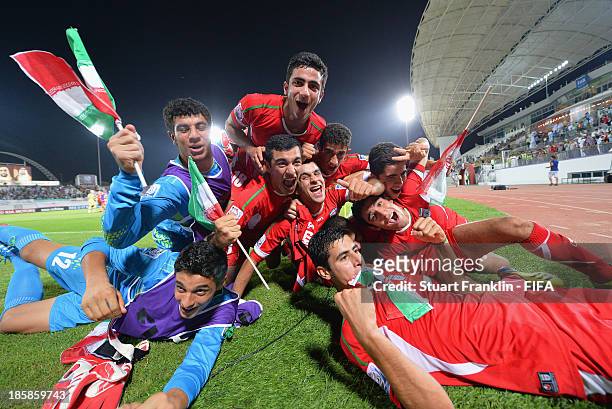 The players of Iran celebrate at the end of the FIFA U 17 World Cup group E match between Austria and Iran at Khalifa Bin Zayed Stadium on October...