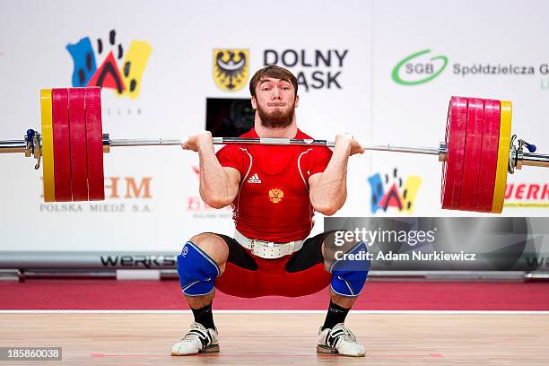 Apti Aukhadov from Russia lifts in the Clean & Jerk competition men's 85 kg Group A during weightlifting IWF World Championships Wroclaw 2013 at...