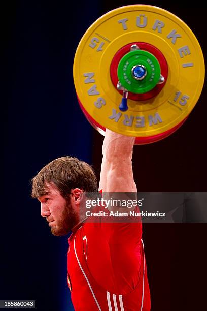 Apti Aukhadov from Russia lifts in the Clean & Jerk competition men's 85 kg Group A during weightlifting IWF World Championships Wroclaw 2013 at...