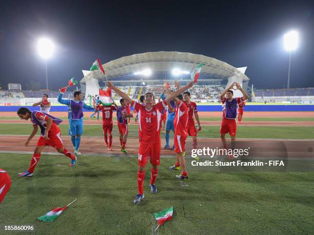 The players of Iran celebrate at the end of the FIFA U 17 World Cup group E match between Austria and Iran at Khalifa Bin Zayed Stadium on October...