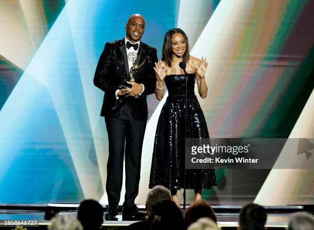 Kevin Frazier and Nischelle Turner accept the award for "Outstanding Entertainment News Series" onstage during the 50th Daytime Emmy Awards at The...