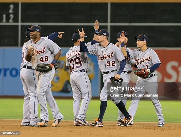 Detroit Tigers players high-five after the victory in Game One of the American League Division Series against the Oakland Athletics at O.co Coliseum...