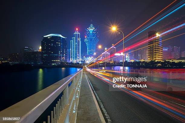 macau-taipa bridge - city lights reflected on buildings speed stock pictures, royalty-free photos & images