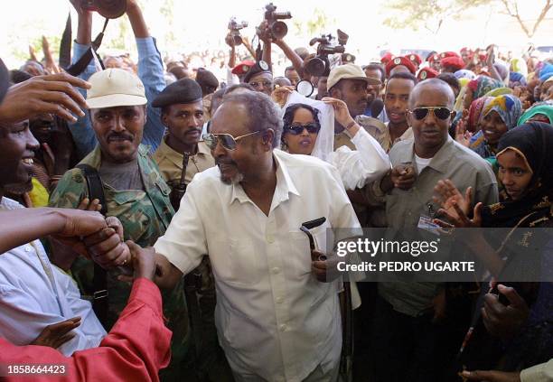 Somaliland "president" Mohamed Ibrahim Egal shakes hands with voters waiting to cast their ballot at a polling station in Hargeisa, Somalia, 31 May...