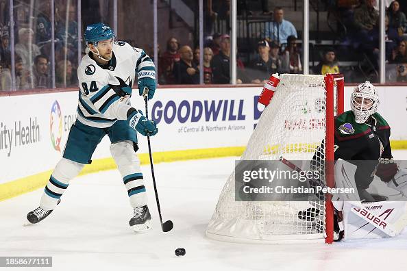 Jan Rutta Jan Rutta of the San Jose Sharks passes the puck ahead of goaltender ...