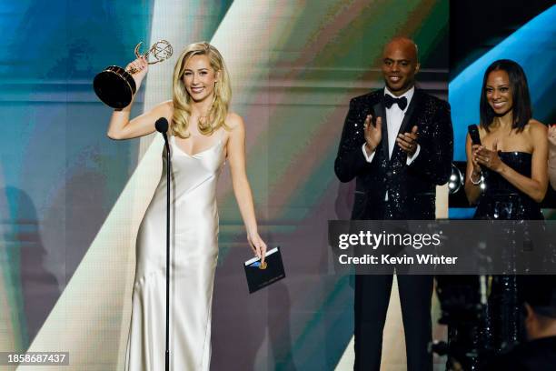 Eden McCoy accepts the award for "Outstanding Younger Performer In A Daytime Drama Series" from Kevin Frazier and Nischelle Turner onstage during the...