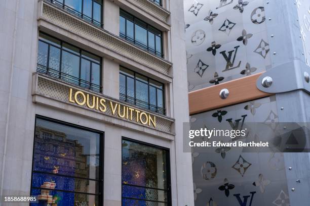 Silver monogrammed giant Louis Vuitton trunk covers exteriors on The Champs Elysees, next to the Louis Vuitton flagship store, on December 15, 2023...