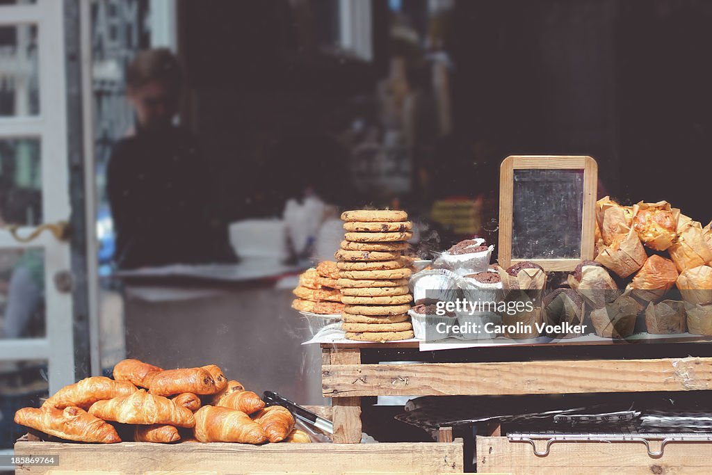 Goods stacked in a shop window of a bakery