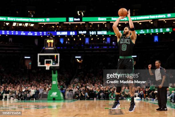 Jayson Tatum of the Boston Celtics takes a three point shot against the Orlando Magic during the second half at TD Garden on December 15, 2023 in...