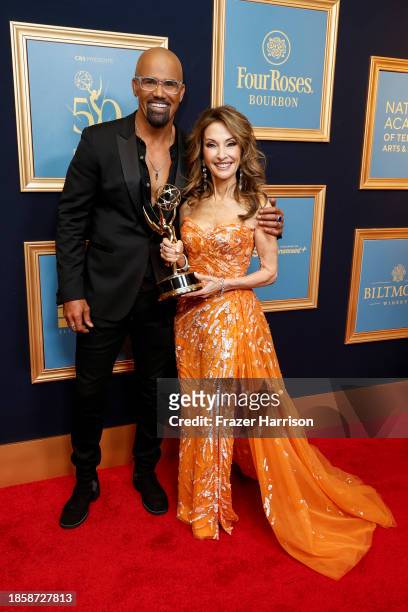 Susan Lucci poses with a "Lifetime Achievement Award" with Shemar Moore in the press room during the 50th Daytime Emmy Awards at The Westin...