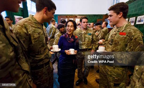 Burmese opposition leader Aung San Suu Kyi joins officer cadets for tea at the Royal Military Academy Sandhurst on October 25, 2013 in Camberley,...