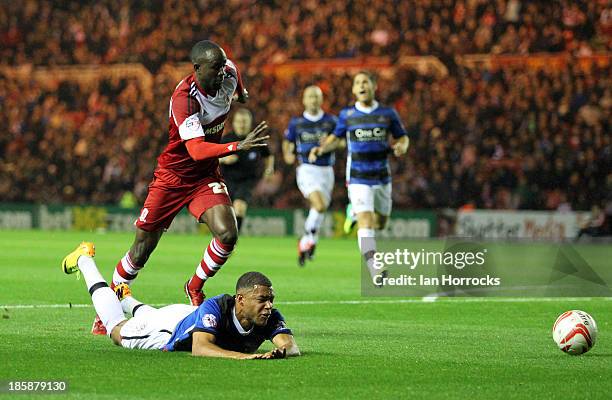 Albert Adomah of Middlesbrough brings down Doncaster's Reece Wabara during the Sky Bet Championship game between Middlesbrough and Doncaster Rovers...