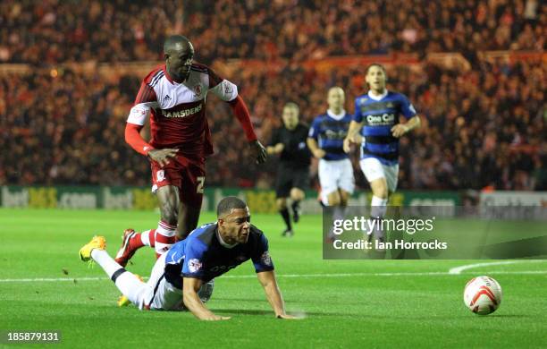 Albert Adomah of Middlesbrough brings down Doncaster's Reece Wabara during the Sky Bet Championship game between Middlesbrough and Doncaster Rovers...