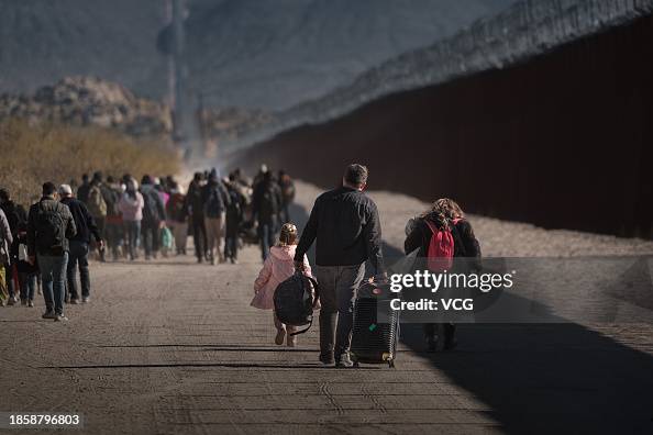 Migrants At The US-Mexico Border