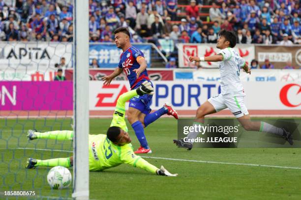 Cristiano of Ventforet Kofu scores the team's second goal past Tando Velaphi of Shonan Bellmareduring the J.League J1 first stage match between...
