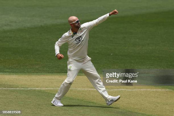 Nathan Lyon of Australia celebrates the wicket of Imam-ul-Haq of Pakistan during day three of the Men's First Test match between Australia and...