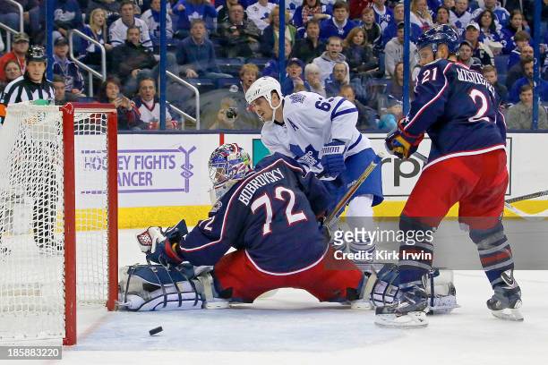 Dave Bolland of the Toronto Maple Leafs beats Sergei Bobrovsky of the Columbus Blue Jackets for a goal during the third period on October 25, 2013 at...