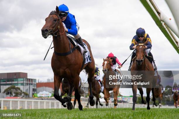 Jamie Kah riding Traffic Warden winning Race 1, the Ive Handicap, during Melbourne Racing at Caulfield Racecourse on December 16, 2023 in Melbourne,...
