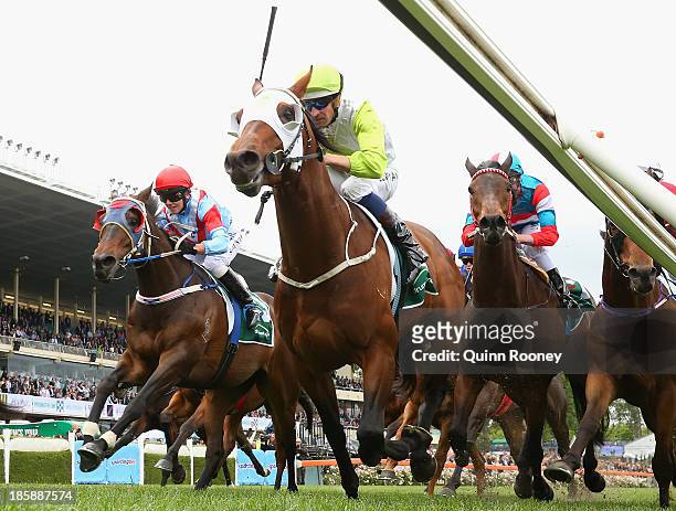 Hugh Bowman riding Hvasstan crosses the line to win the Drummond Golf Handicap during Cox Plate Day at Moonee Valley Racecourse on October 26, 2013...