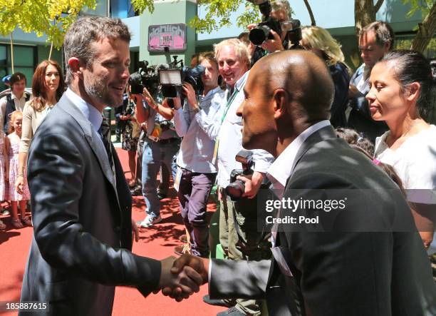 Prince Frederik of Denmark meets former Australian rugby union player, George Gregan at the Children's Hospital during a visit to the Australian Twin...