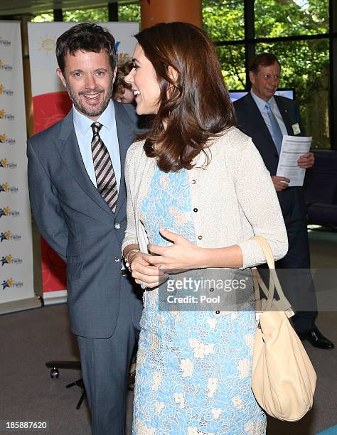 Prince Frederik of Denmark and Princess Mary of Denmark walk through the Australian Twin Registry at the Children's Hospital on October 26, 2013 in...
