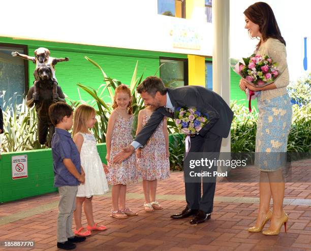 Prince Frederik of Denmark and Princess Mary of Denmark greet Kai , Siobhan Pereira , Lillian and Charlotte Harding as the royal couple arrive for a...