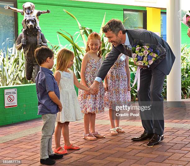 Prince Frederik of Denmark chats with Kai , Siobhan Pereira , Lillian and Charlotte Harding as the royal couple arrive for a visit to the Australian...