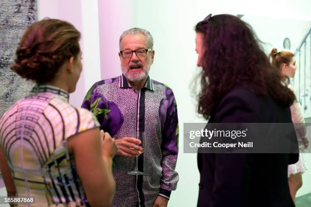 Howard Rachofsky speaks with guests during the Young Collectors Two x Two Cocktail party at the Rachofsky House on October 25, 2013 in Dallas, Texas.