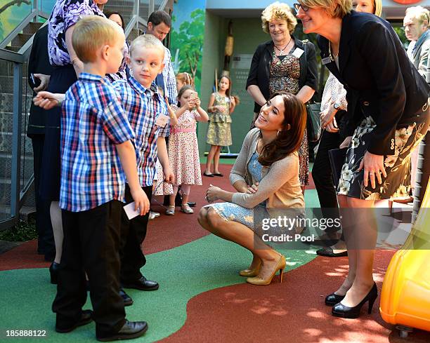 Princess Mary of Denmark meets with identical twins during a visit to the Australian Twin Registry at the Sydney Children's Hospital on October 26,...