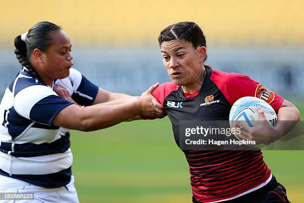 Amiria Rule of Canterbury fends Mele Hufanga of Auckland during the Women's Provincial Final between Canterbury and Auckland at Westpac Stadium on...