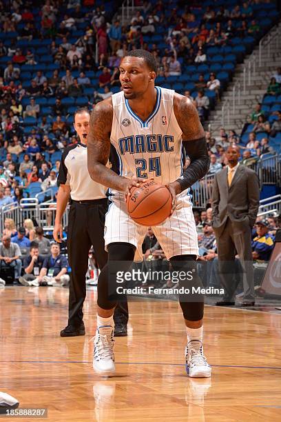 Romero Osby of the Orlando Magic looks to pass the ball against the New Orleans Pelicans the game on October 25, 2013 at Amway Center in Orlando,...