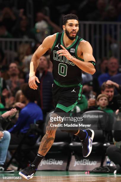 Jayson Tatum of the Boston Celtics celebrates after scoring against the Orlando Magic during the first half at TD Garden on December 15, 2023 in...