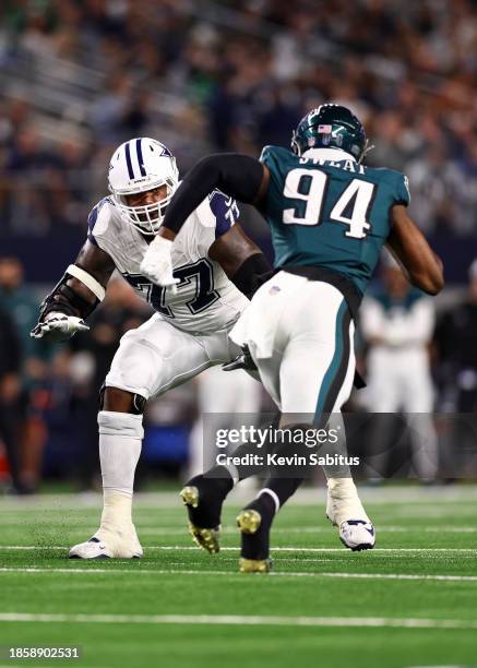 Tyron Smith of the Dallas Cowboys blocks Josh Sweat of the Philadelphia Eagles during an NFL football game at AT&T Stadium on December 10, 2023 in...