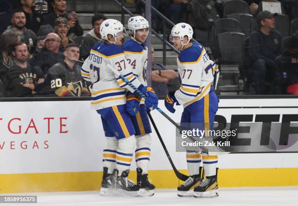 Casey Mittelstadt of the Buffalo Sabres celebrates with teammates after scoring an empty-net goal during the third period against the Vegas Golden...