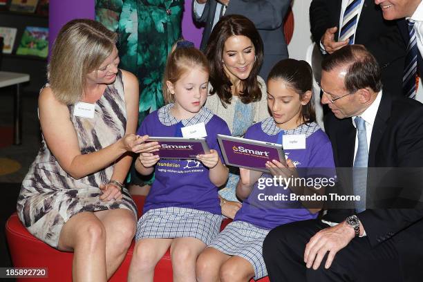 Princess Mary of Denmark and Australian Prime Minister, Tony Abbott look on as young school students browse the internet at the launch of eSmart...