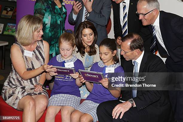 Princess Mary of Denmark, Minister of Communications, Malcolm Turnbull and Australian Prime Minister, Tony Abbott look on as young school students...