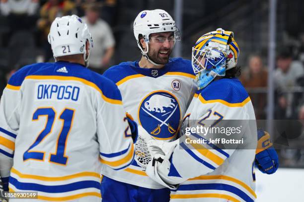 Alex Tuch of the Buffalo Sabres congratulates Devon Levi after a 6-3 victory against the Vegas Golden Knights at T-Mobile Arena on December 15, 2023...