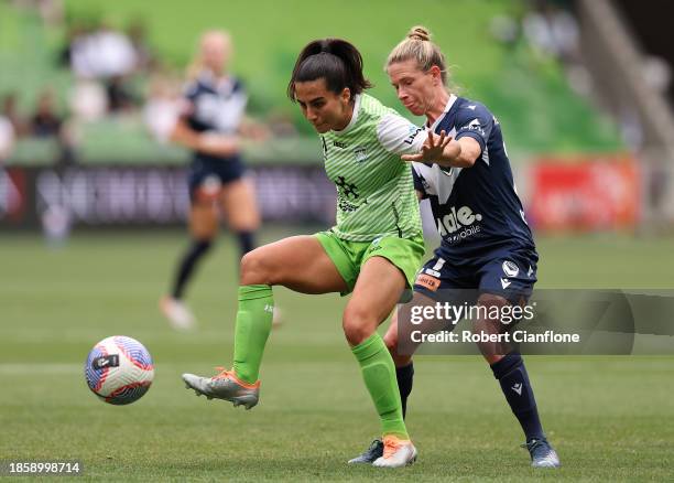 Vesna Milivojevi of Canberra United is challenged by Elise Kellond-Knight of the Victory during the A-League Women round 8 match between Melbourne...