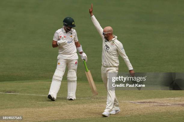 Nathan Lyon of Australia celebrates the wicket of Aamer Jamal of Pakistan during day three of the Men's First Test match between Australia and...