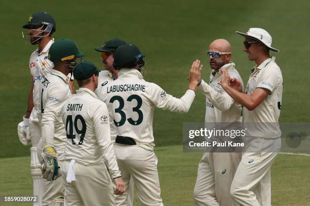 Nathan Lyon of Australia celebrates the wicket of Aamer Jamal of Pakistan during day three of the Men's First Test match between Australia and...