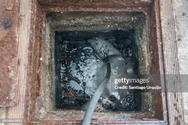 inspecting the damage on a home sewer pipe - surveillance monitor stock pictures, royalty-free photos & images