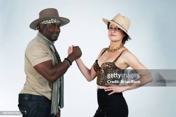 Serbian blues rock guitarist and singer Ana Popovic and bass player and musical director Buther Burns, pose during a photo session on May 23, 2022 in...