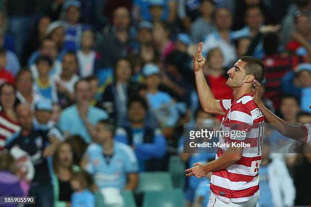 Iacopo La Rocca ofthe Wanderers gestures to the Sydney FC supporters as he celebrates scoring a goal during the round three A-League match between...