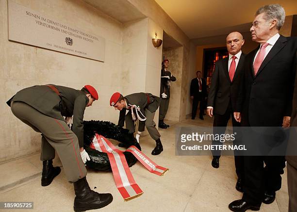 Austrian President Heinz Fischer and Austrian Defence Minister Gerhard Klug attend a wreath lying ceremony at the monument of the unknown soldier in...