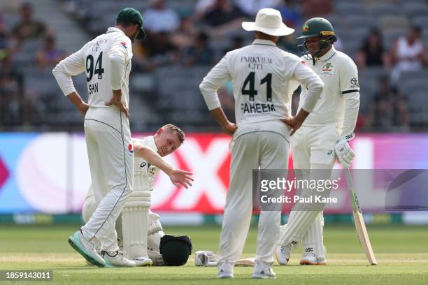 Marnus Labuschagne of Australia looks at this right hand after being struck by a delivery from Khurram Shahzad of Pakistan during day three of the...