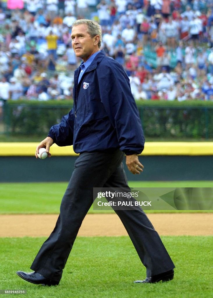 Bush Baseball US President George W. Bush strides to the mound to throw the first ...