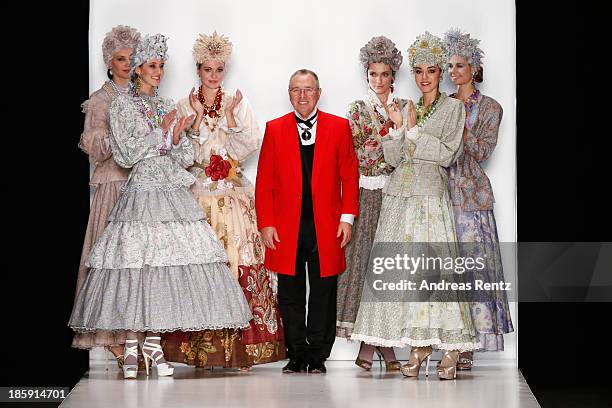 Designer Slava Zaitsev walks the runway after the "SLAVA ZAITSEV Pret-A-porter De Luxe" show during Mercedes-Benz Fashion Week Russia S/S 2014 on...